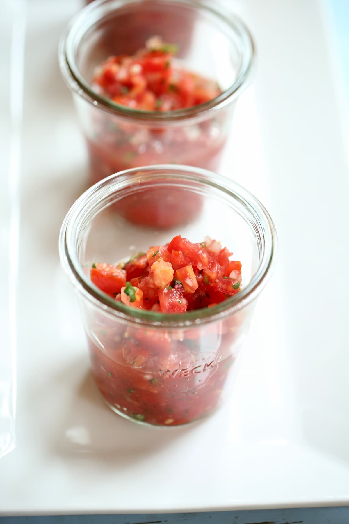 a small glass jar of salsa.