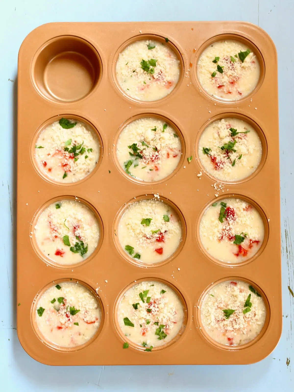 a muffin tin of egg white bites that are now cooked.