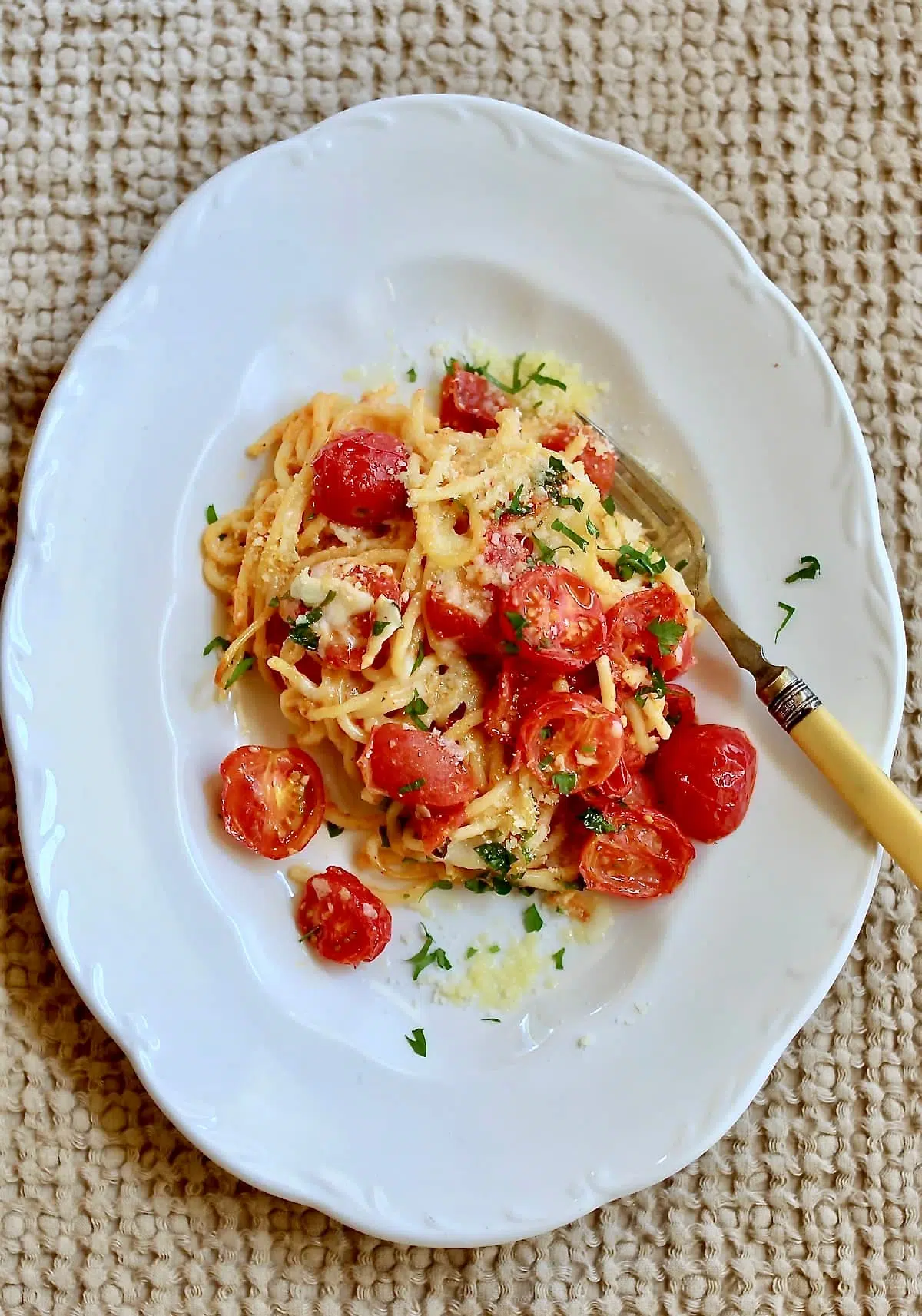 a white plate of pasta.