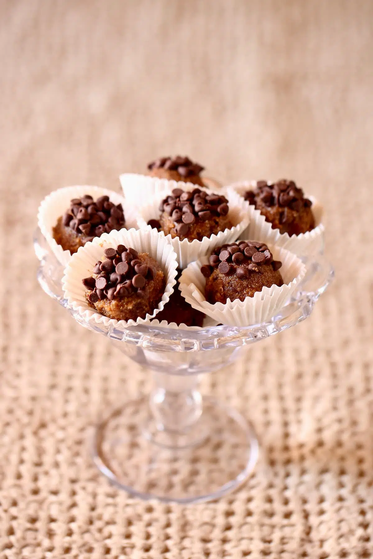 a small glass dish with cookie dough bites in it.  