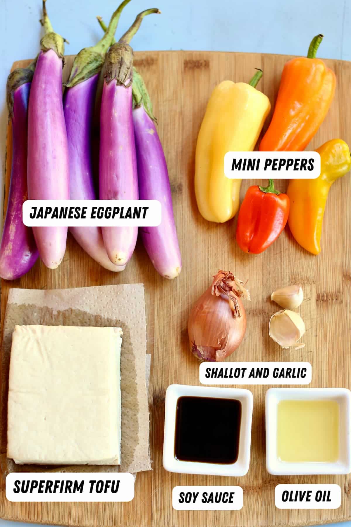 a cutting board of ingredients for eggplant tofu.