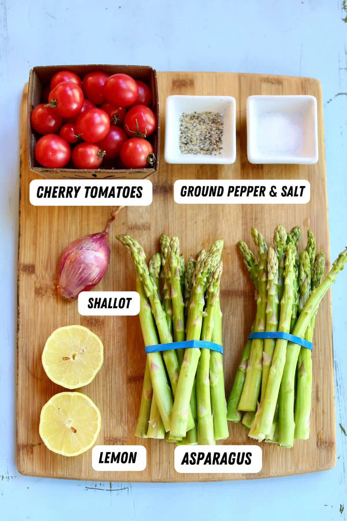 a cutting board of ingredients for an asparagus recipe.  