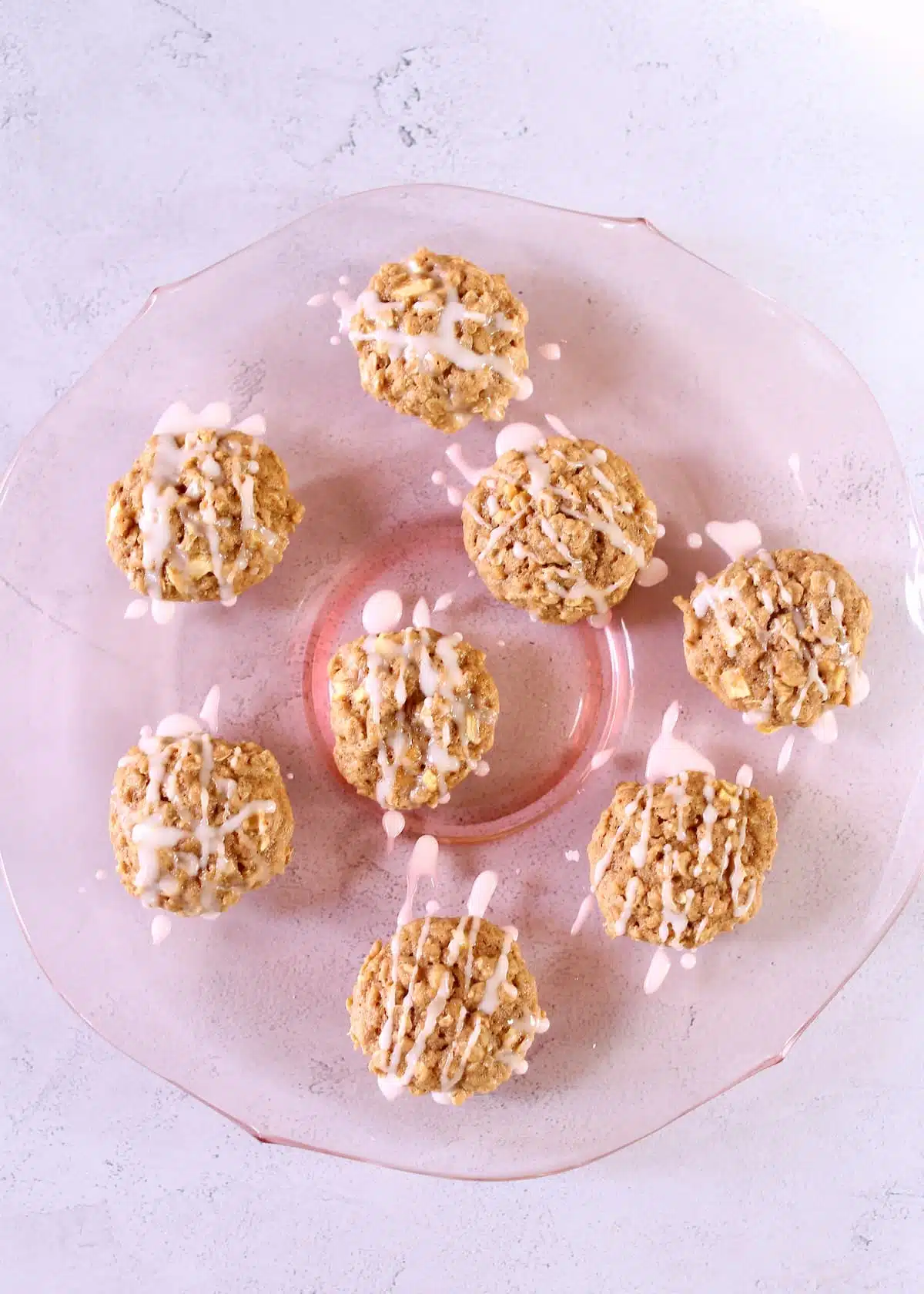 a pink glass tray with cookies on it.