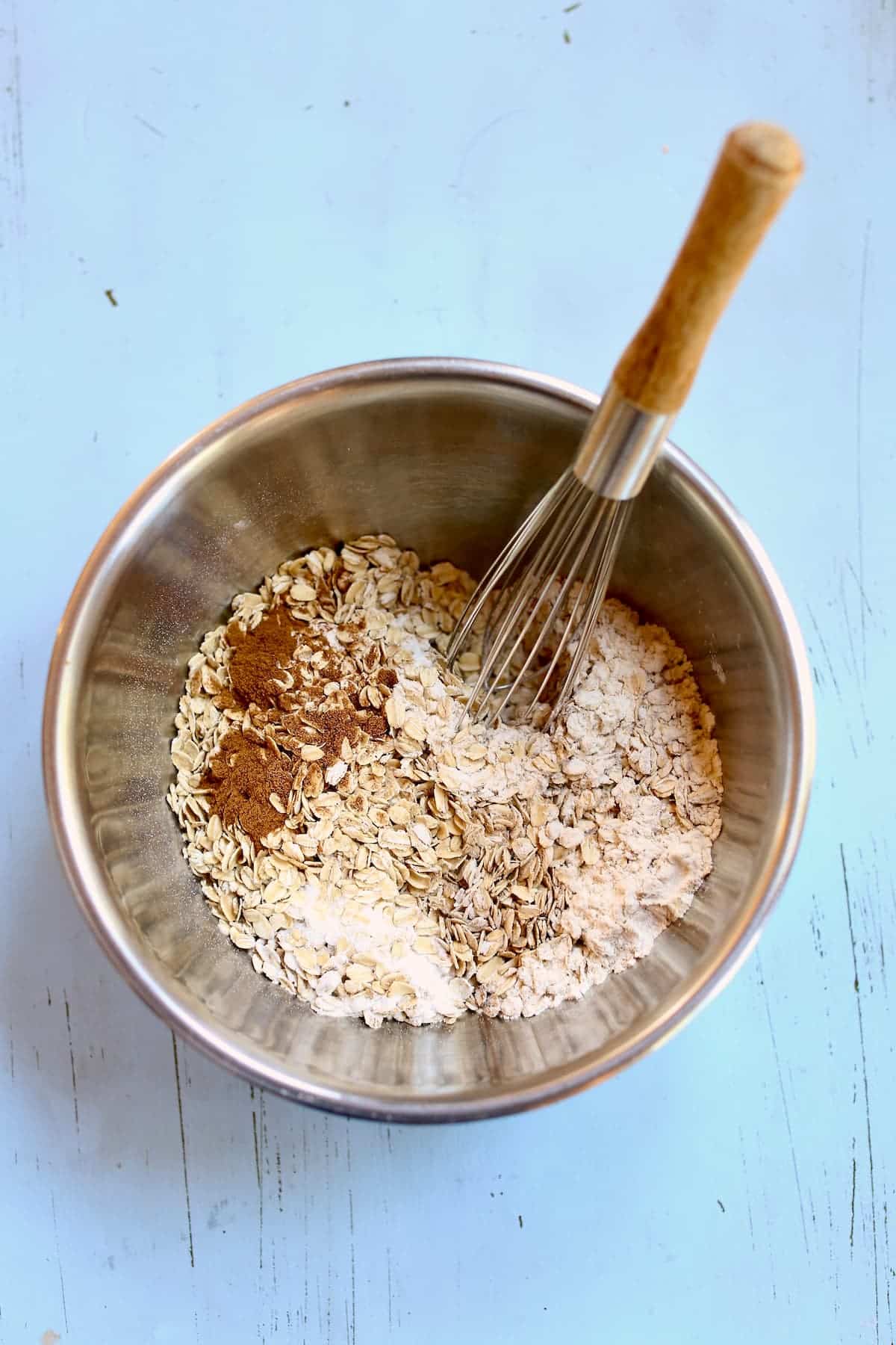 a silver bowl of dry ingredients for cookie dough.