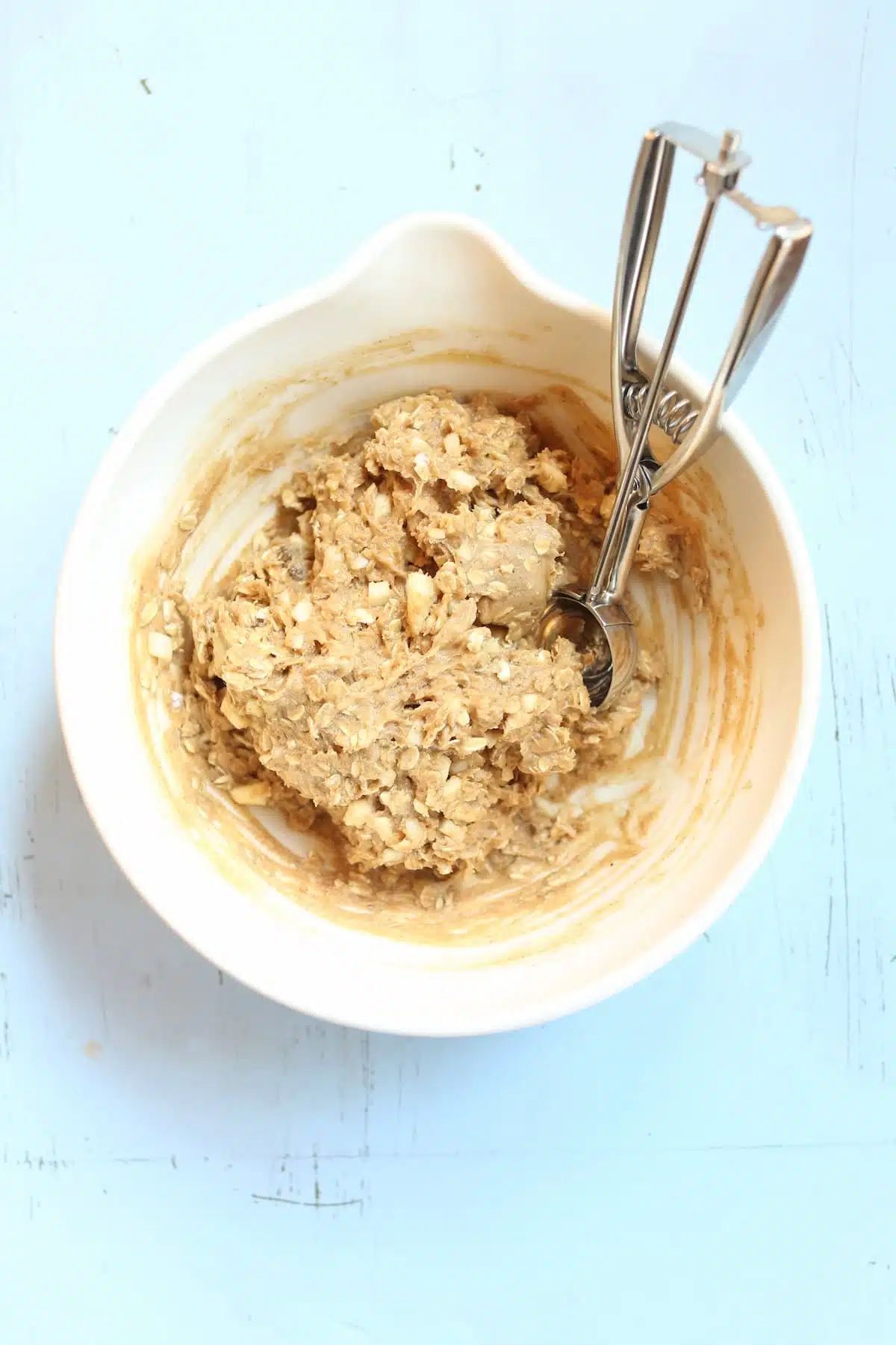 a white bowl of cookie dough.