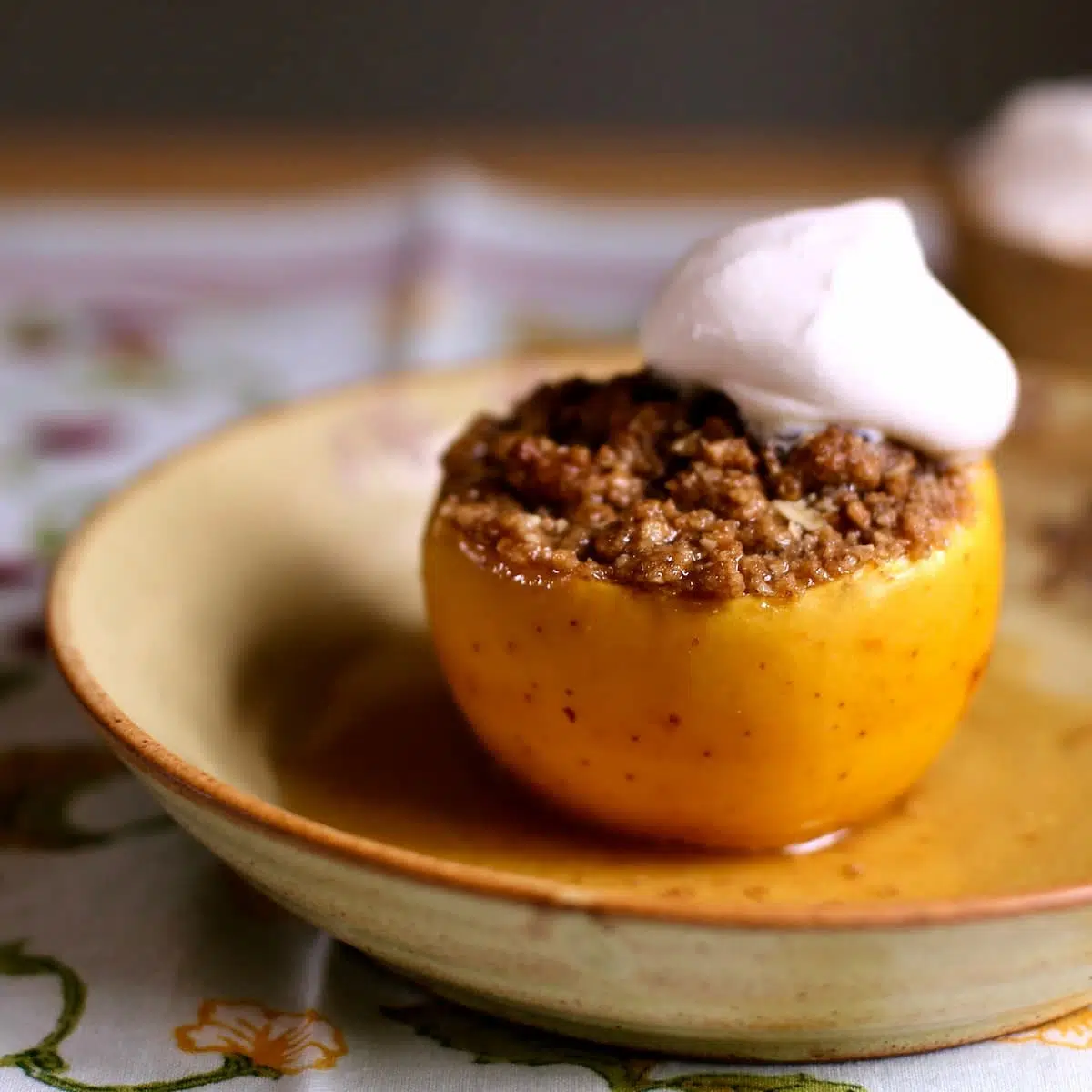 a baked apple on a plate.