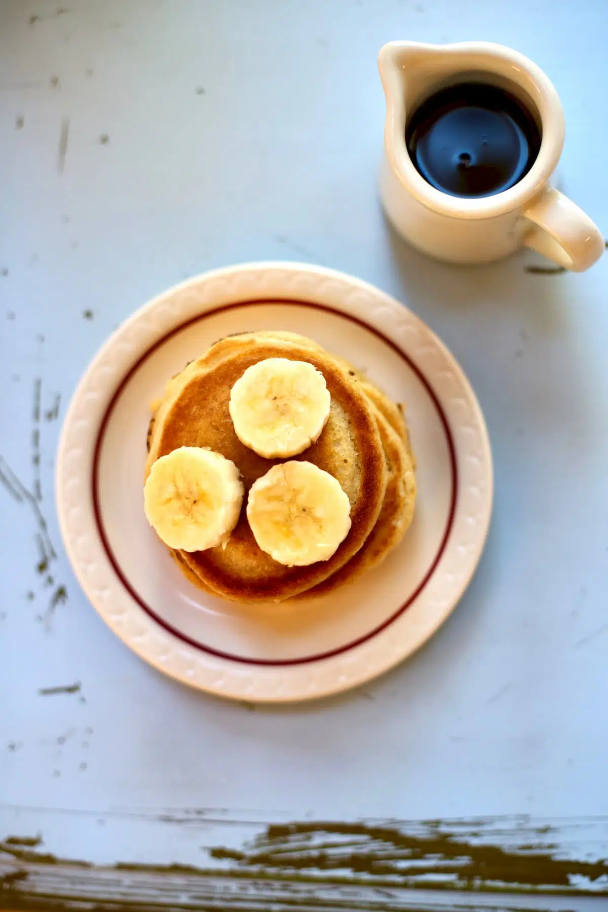 a plate of pancakes on a blue table.