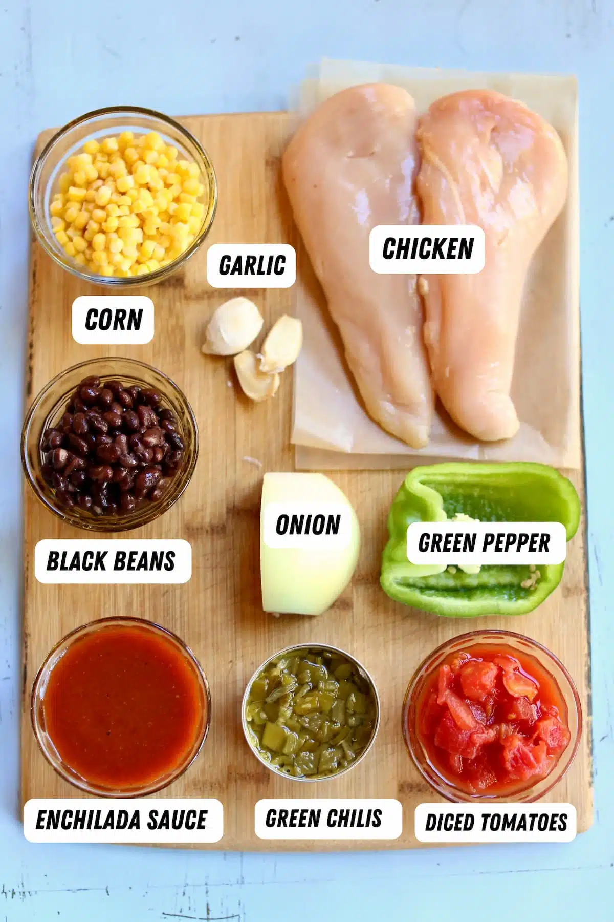a cutting board of ingredients for soup.