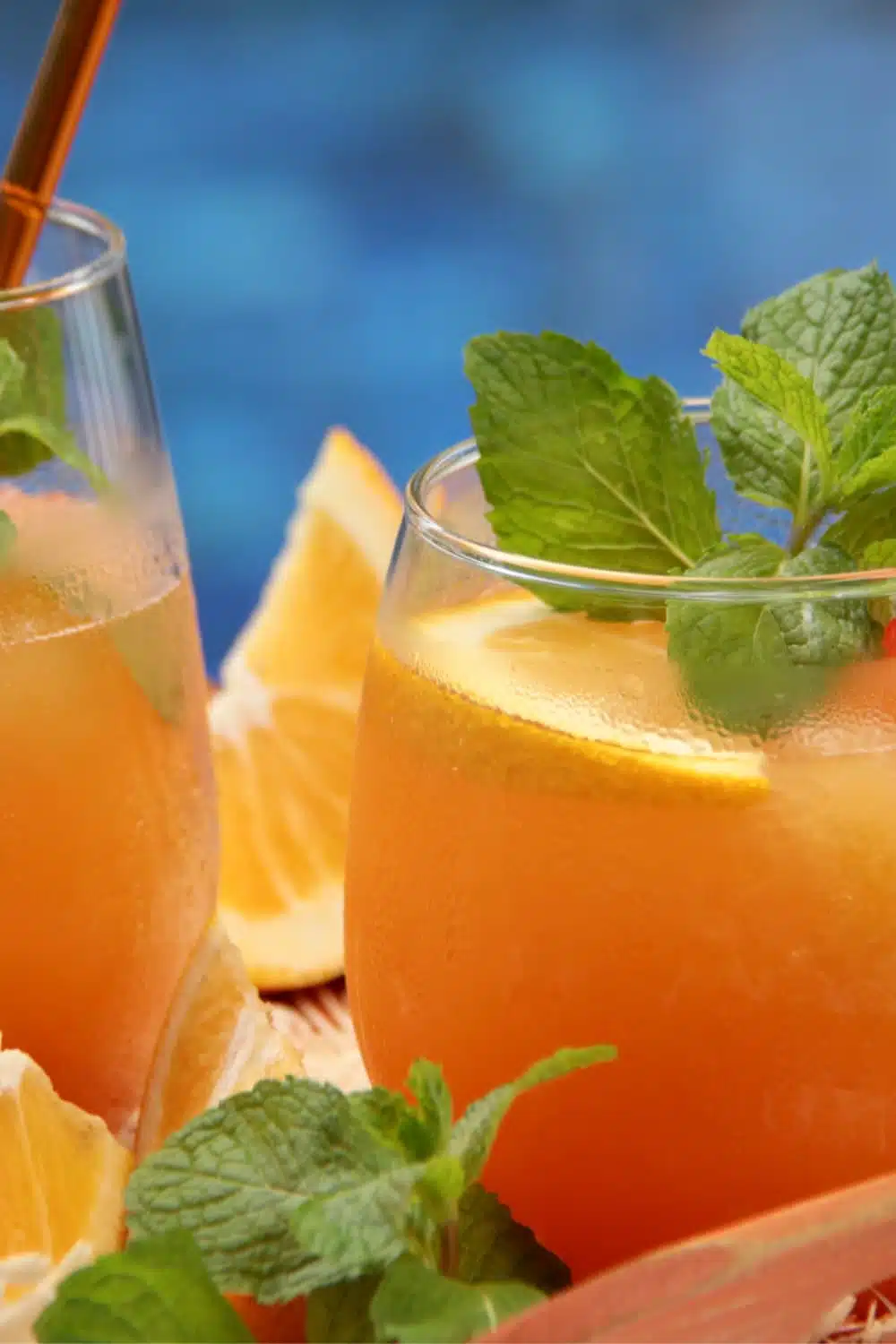 an image of a mocktail, an orange non-alcoholic drink. 