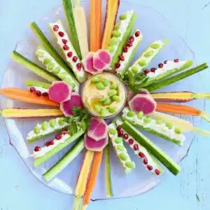 a vegetable tray on a blue table.