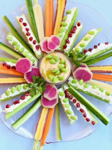 a vegetable tray on a blue table.