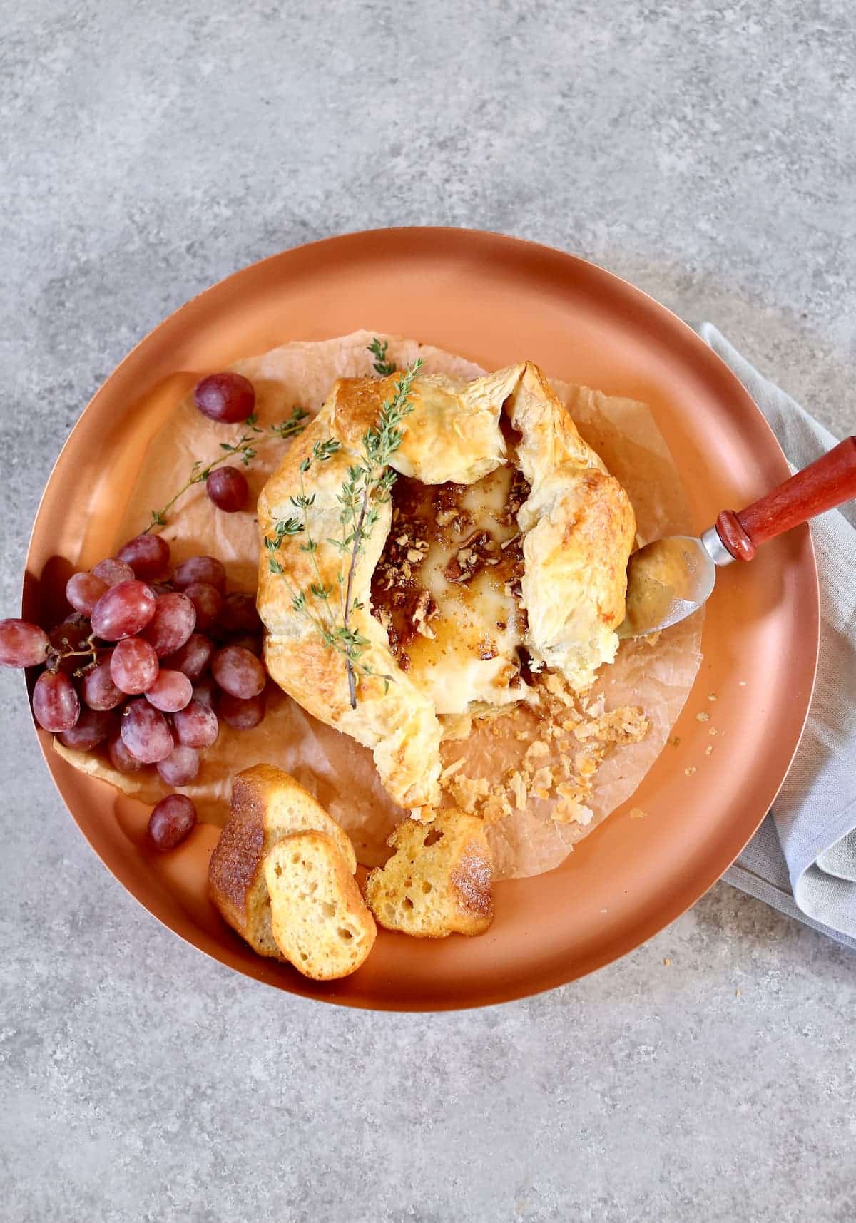 an overhead photo of baked brie with fig jam.