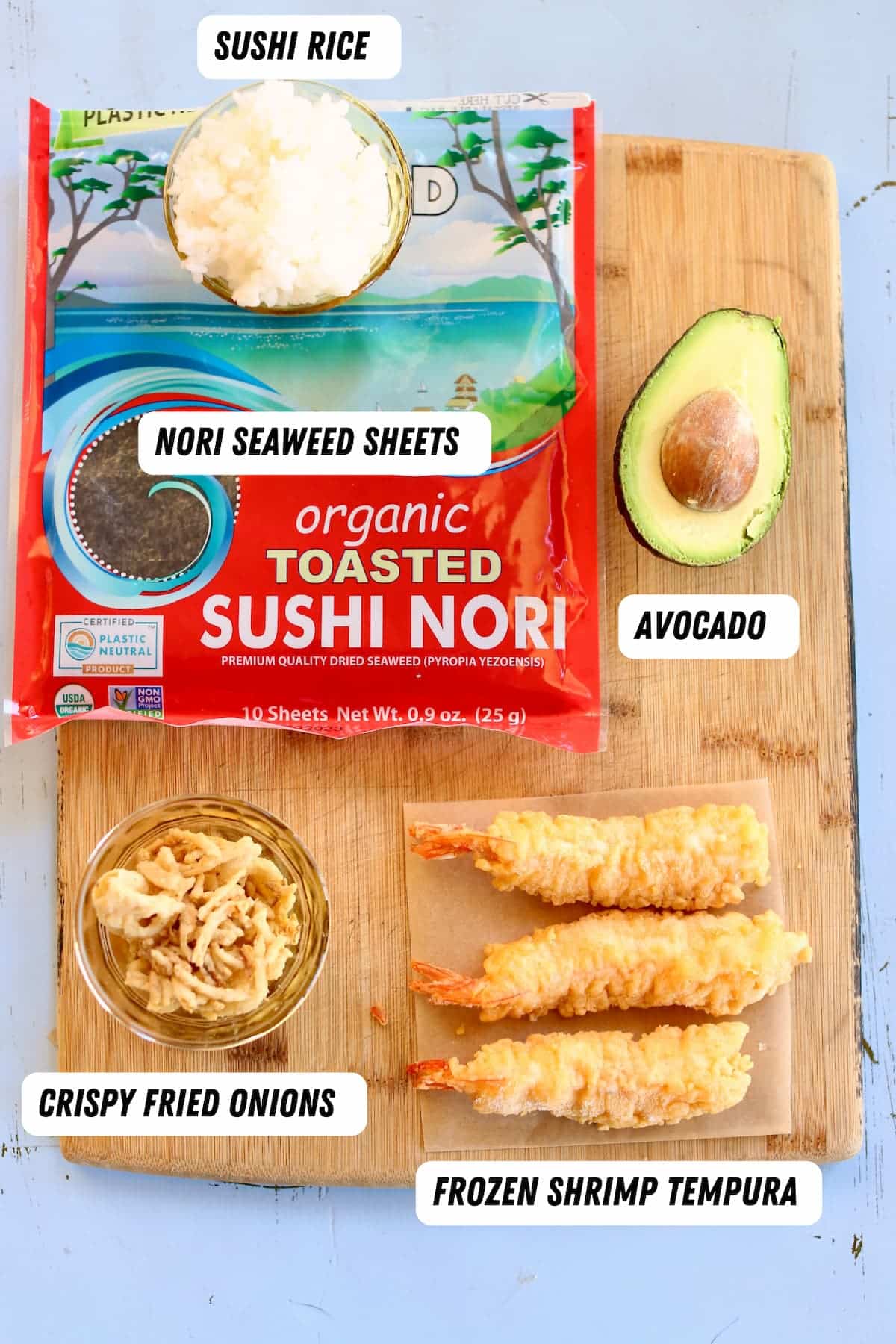 ingredients for sushi rolls on a cutting board.