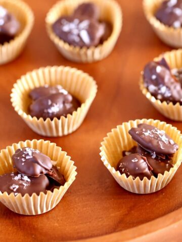 a close up photo of chocolate covered pecans.