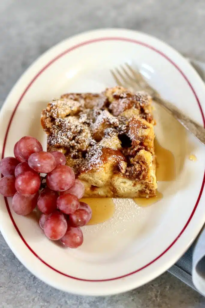 a piece of breakfast casserole on a white plate.