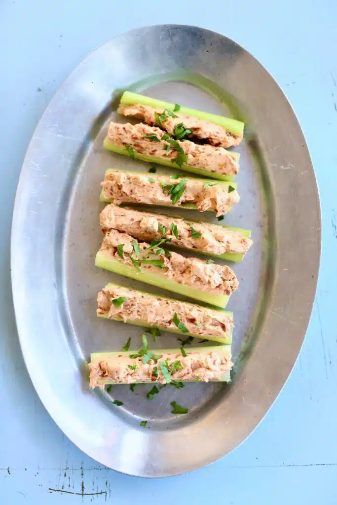 some stuffed celery on a silver platter.