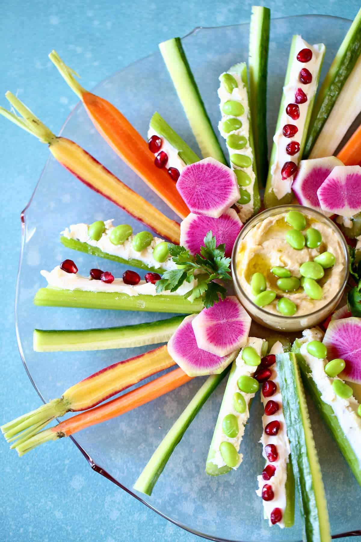 a platter of vegetables, arranged decoratively.  