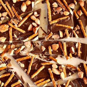 a close up photo of chocolate bark and pretzels.