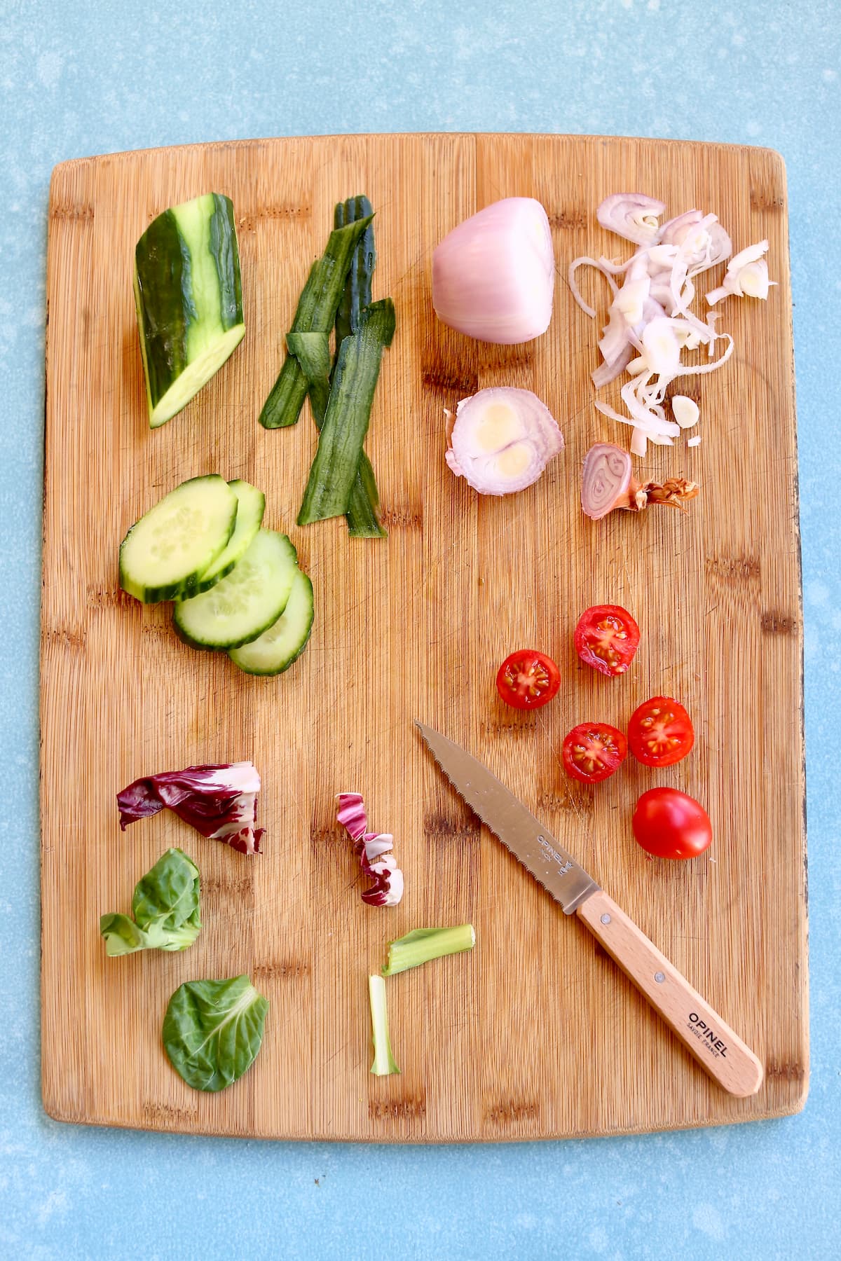 ingredients for a salad on a cutting board.