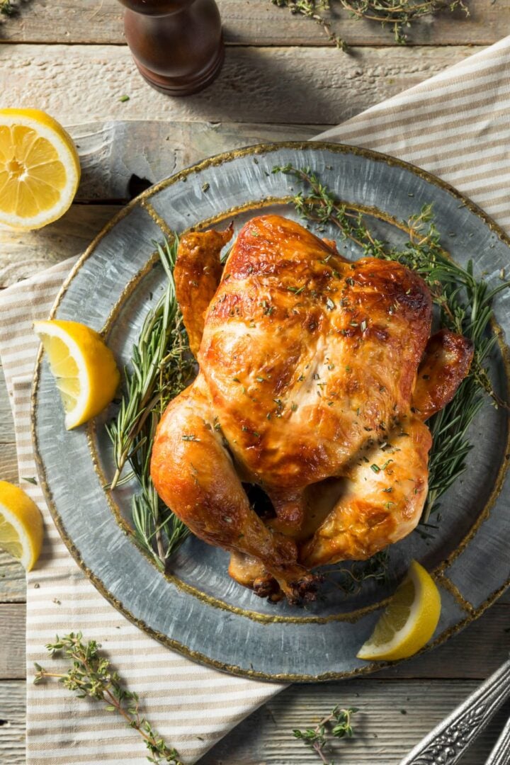 a rotisserie chicken on a table.