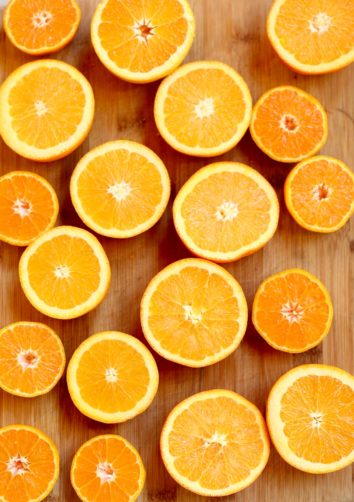 a full table of cut oranges.