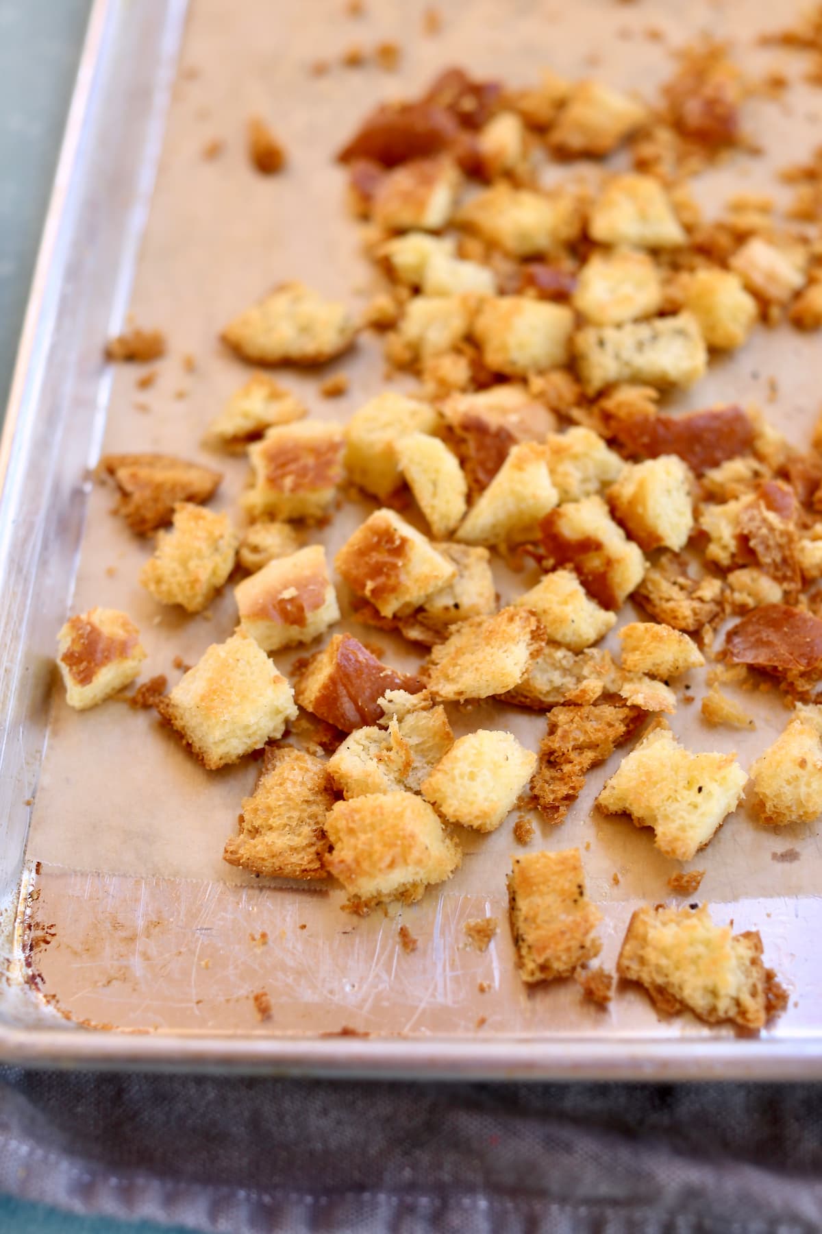 a baking sheet of baked croutons.