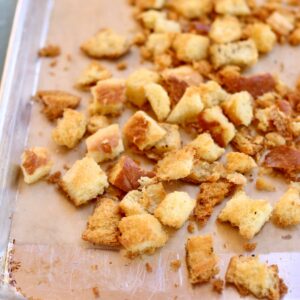 a square photo of a sheet pan of croutons.