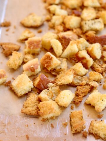 a square photo of a sheet pan of croutons.
