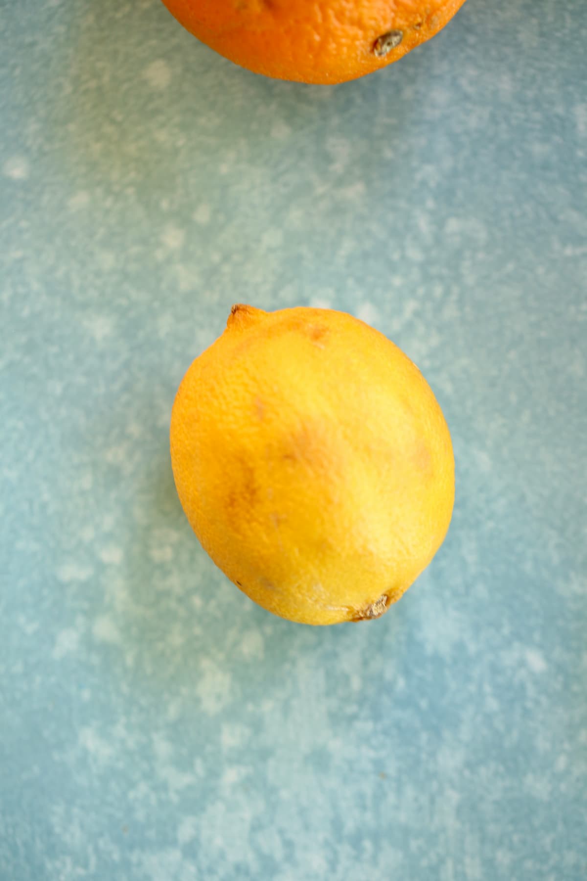 an old dry lemon on a blue table.