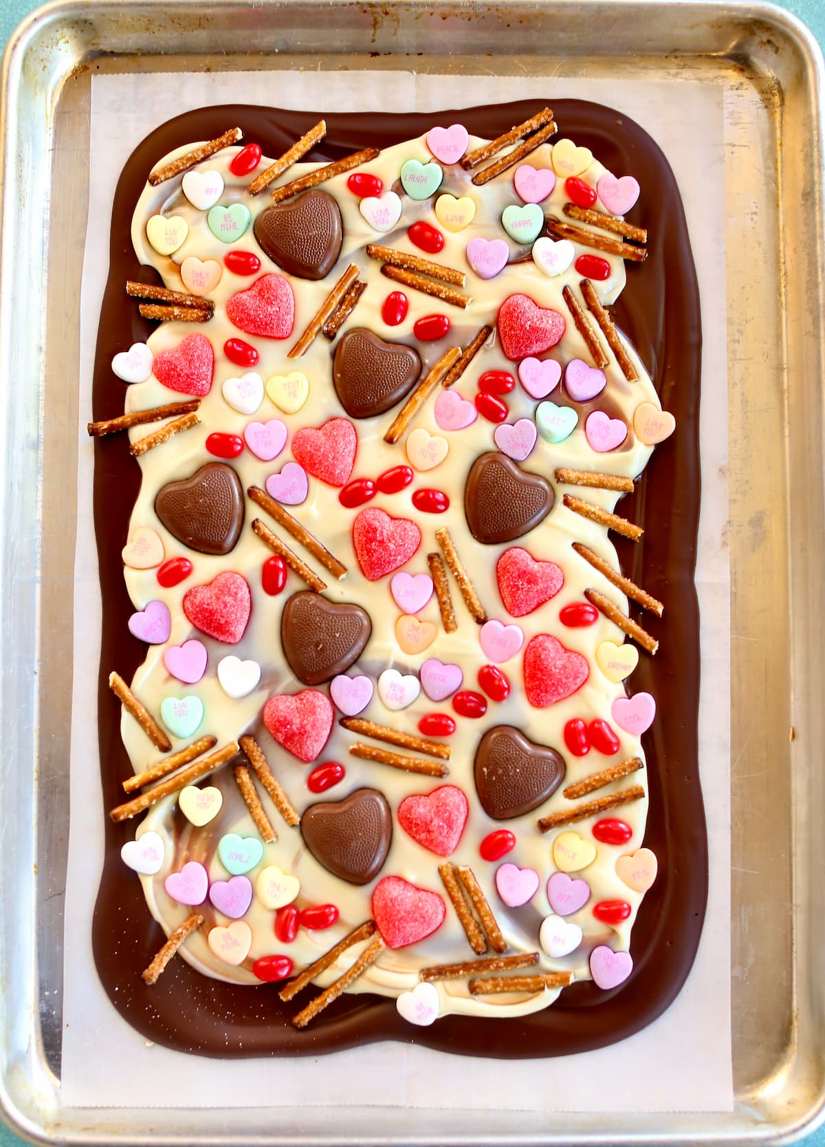 an overhead photo of chocolate bark with candy in it.