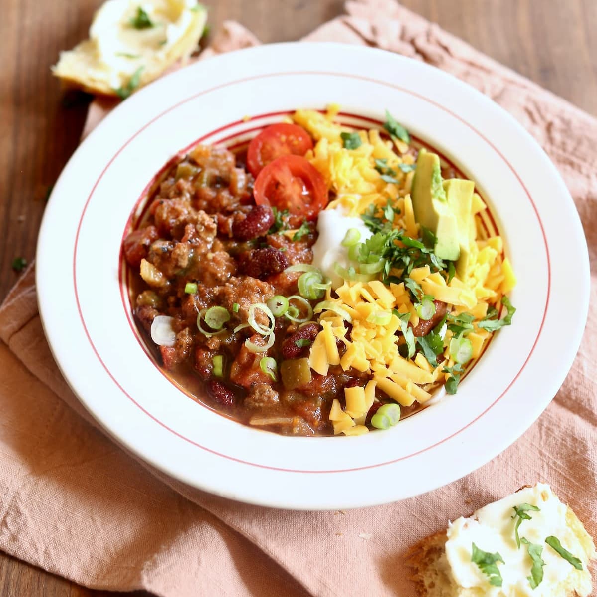 a square photo of irish chili with all the fixings.