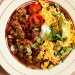 a bowl of irish chili on a table with text overlay saying the recipe name.