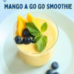 a side photo of a mango smooth with blueberries and text overlay.