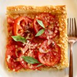 a pinterest image of a tomato pie with text overlay saying the recipe name.