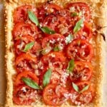 a close up photo of a tomato pie with text overlay for pinterest.