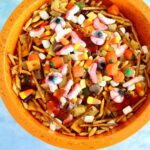 A large orange bowl of fall snack mix with text overlay saying the recipe name.