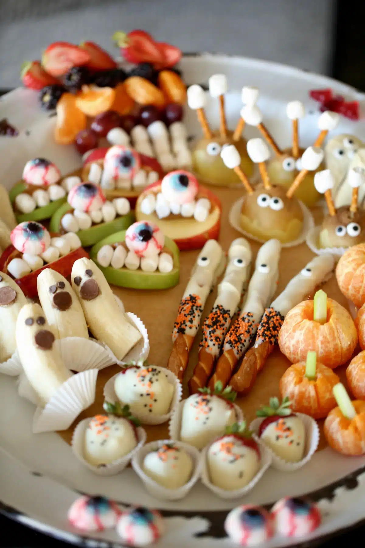 A side view photo of fruit halloween snacks.